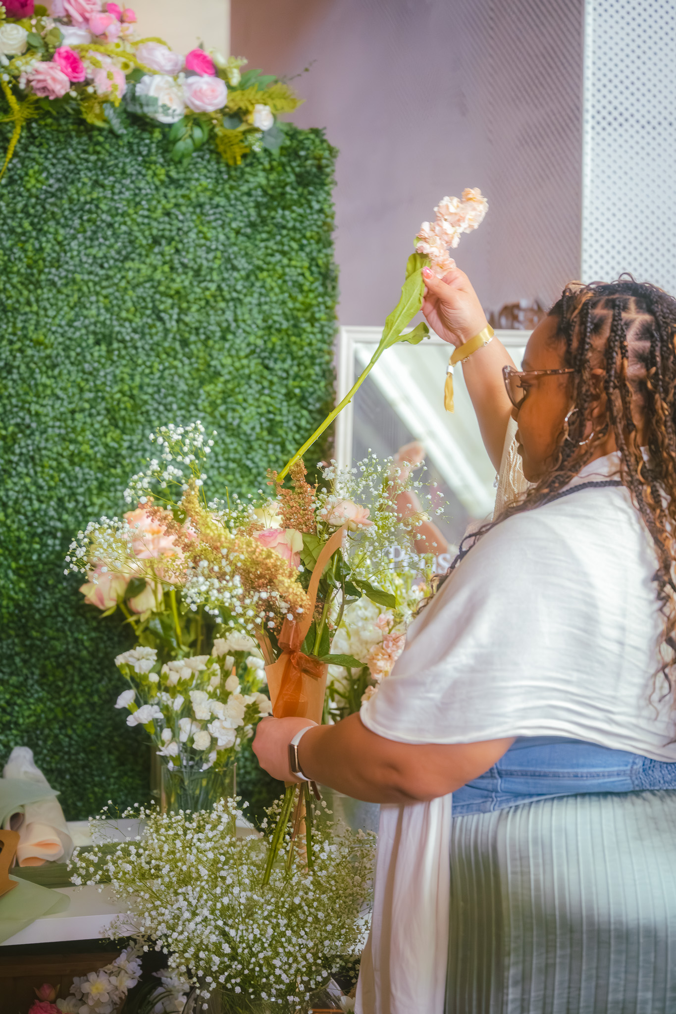 Guest choosing stems at the floral bar